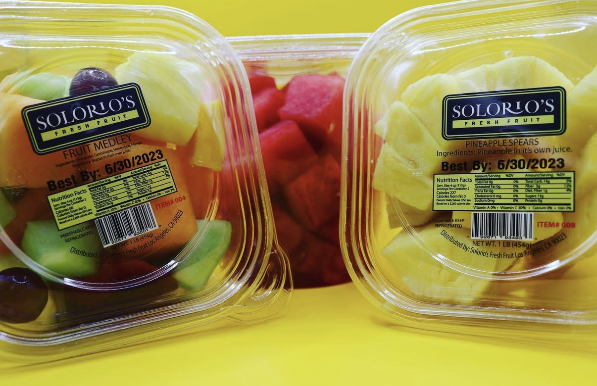 Solorio's labeled fruit medley and pineapple spear cups